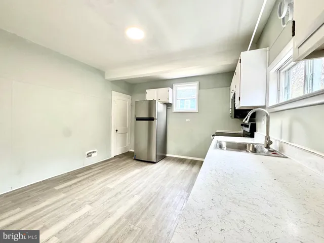 a view of a kitchen with a sink