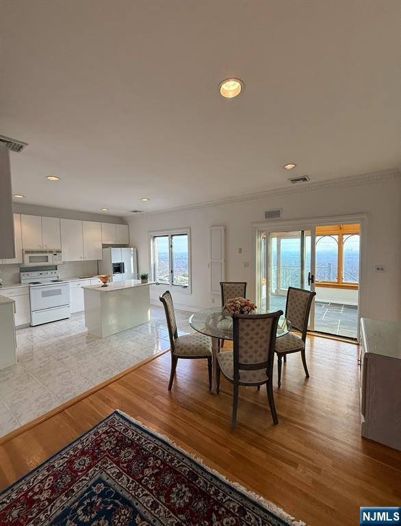 24 Club Way Cedar Grove, NJ 07009 - Photo 11 of 18 a dining room with furniture and wooden floor