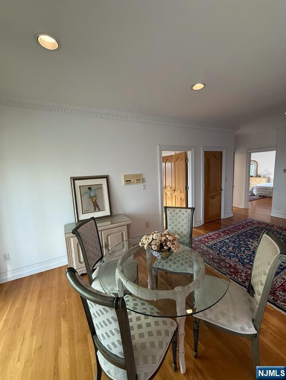 24 Club Way Cedar Grove, NJ 07009 - Photo 14 of 18 a view of a dining room with furniture and wooden floor