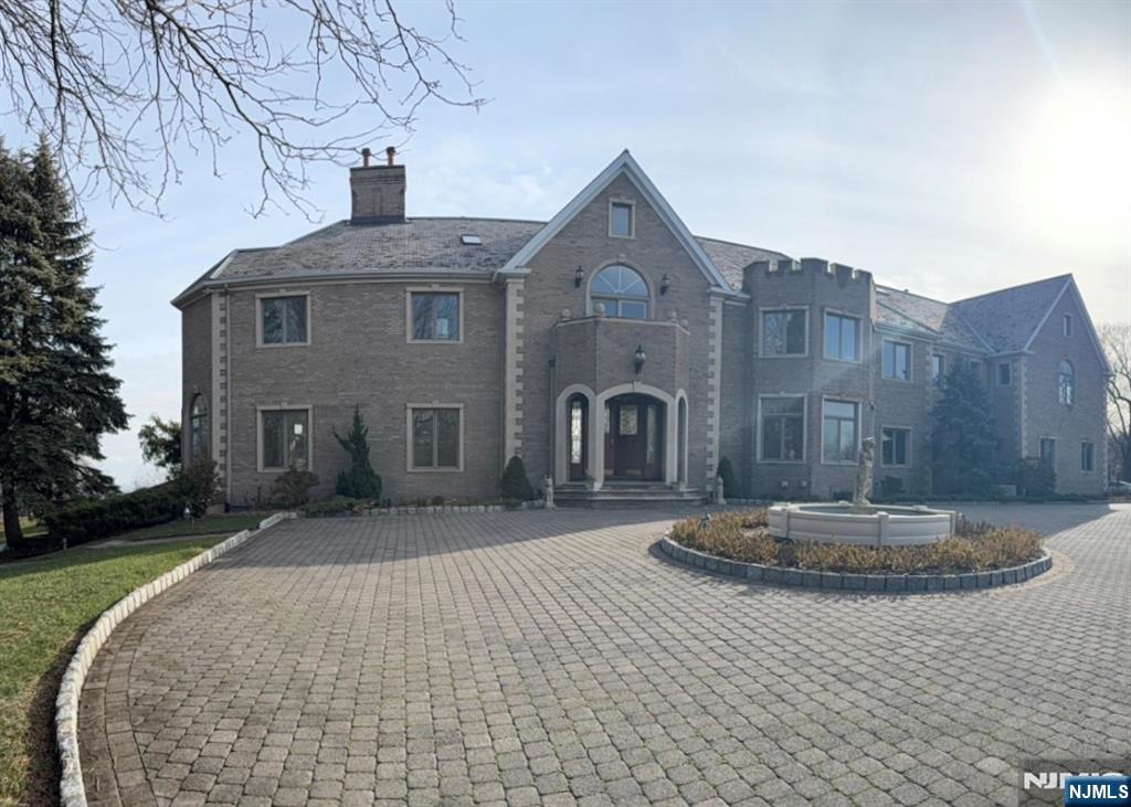 24 Club Way Cedar Grove, NJ 07009 - Photo 18 of 18 a front view of a house with a yard