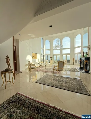 a living room with lots of furniture and a rug