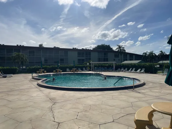 a view of a swimming pool with a patio