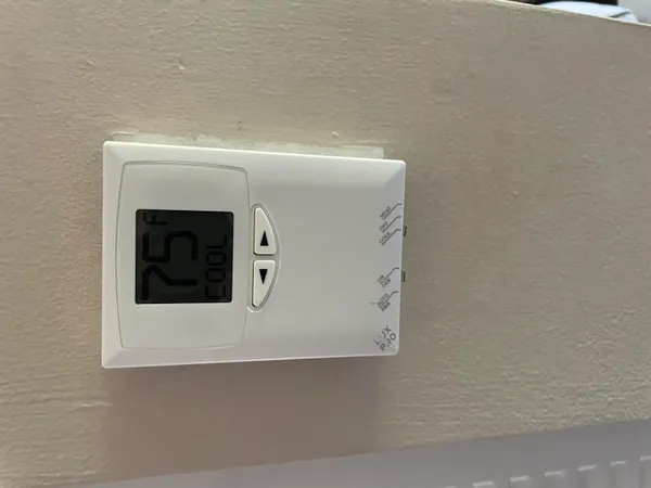 a view of a patio with couches table and chairs and potted plants
