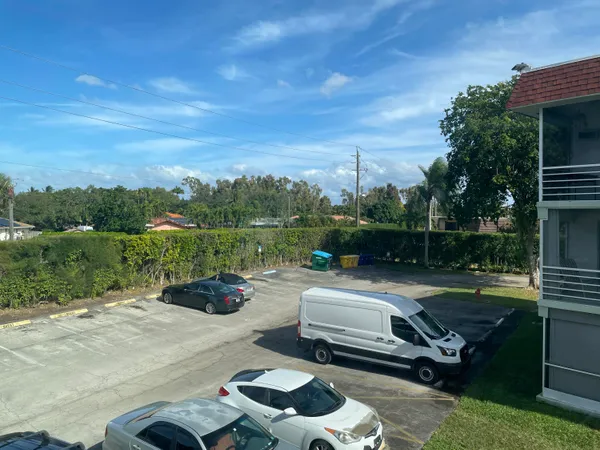 a view of a yard with basketball court