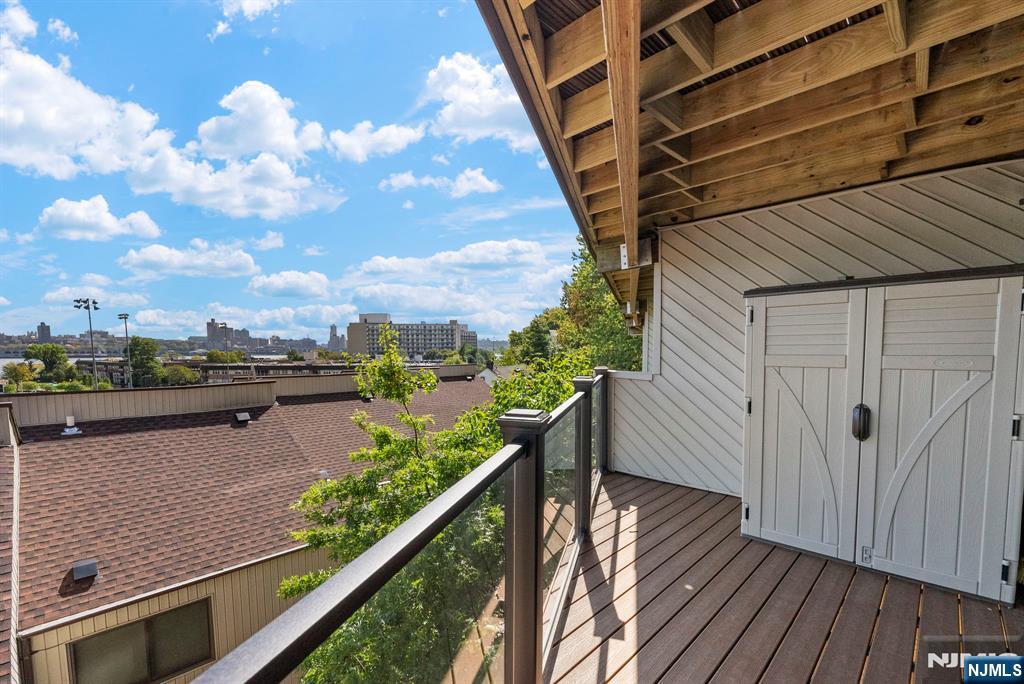 101 Highway 5, Unit 206 Edgewater, NJ 07020 - Photo 31 of 48 a view of balcony with wooden floor