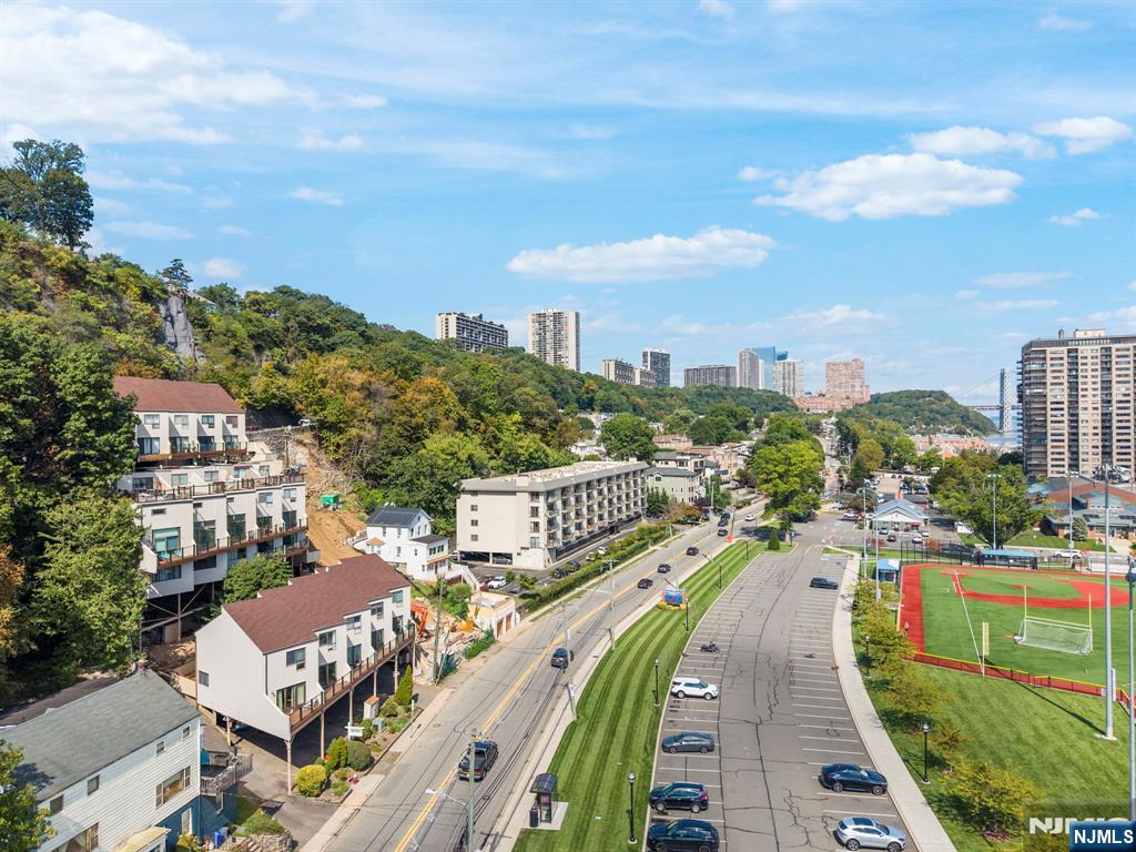 101 Highway 5, Unit 206 Edgewater, NJ 07020 - Photo 44 of 48 a city view with tall buildings