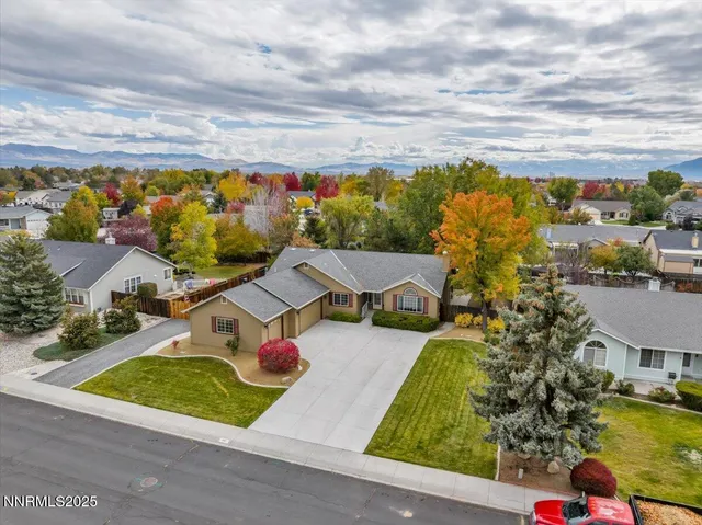 an aerial view of a house with a garden