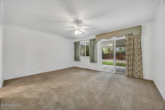 a view of an empty room with windows