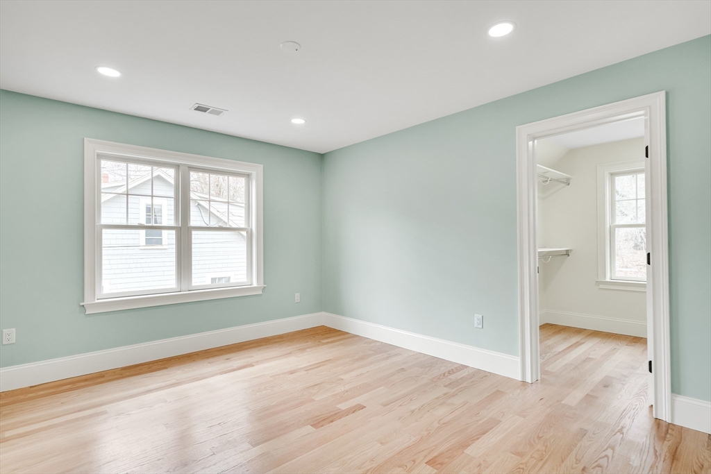 232 Lincoln Street Lexington, MA 02421 - Photo 26 of 41 an empty room with wooden floor and windows