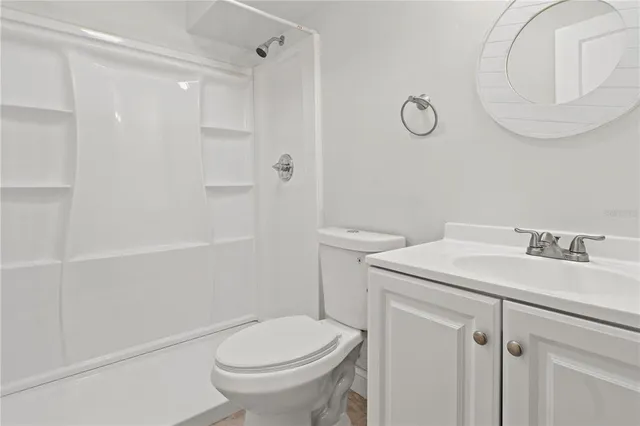 a kitchen with stainless steel appliances granite countertop a sink a stove and a microwave