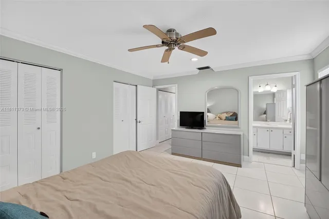 a bedroom with two large bed and two large window