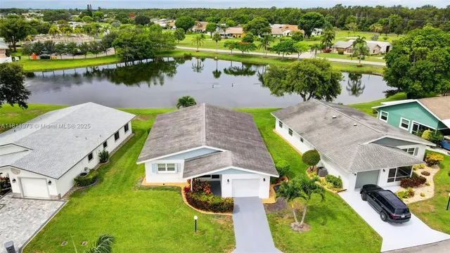an aerial view of a house with a garden