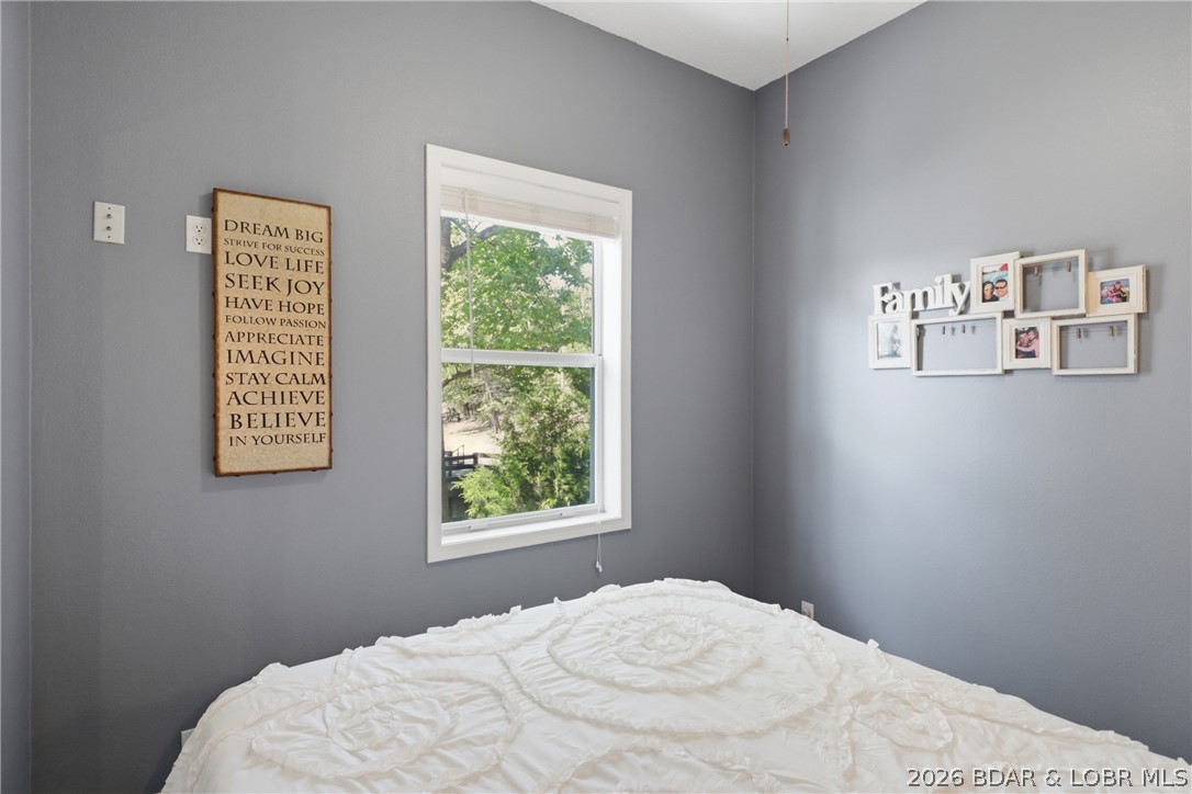 1492 Purvis Road Sunrise Beach, MO 65079 - Photo 18 of 41 Secondary upper-level bedroom