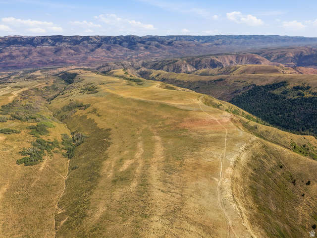 10780 Ford Ridge Road Helper, UT 84526 - Photo 5 of 38 Expansive mountainous terrain with varied topography, including rolling hills and forested valleys