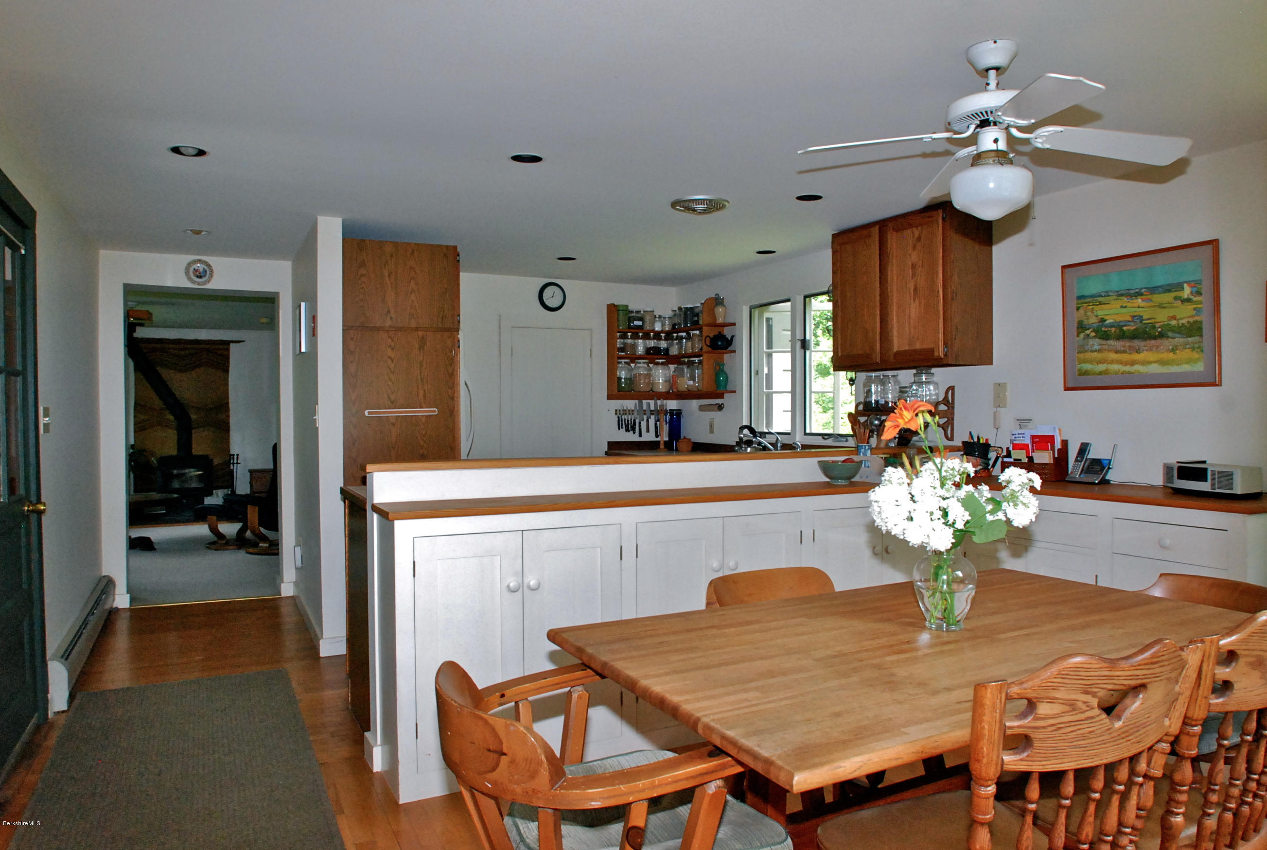 49 River Road Monterey, MA 01245 - Photo 11 of 43 a dining room with furniture and chandelier