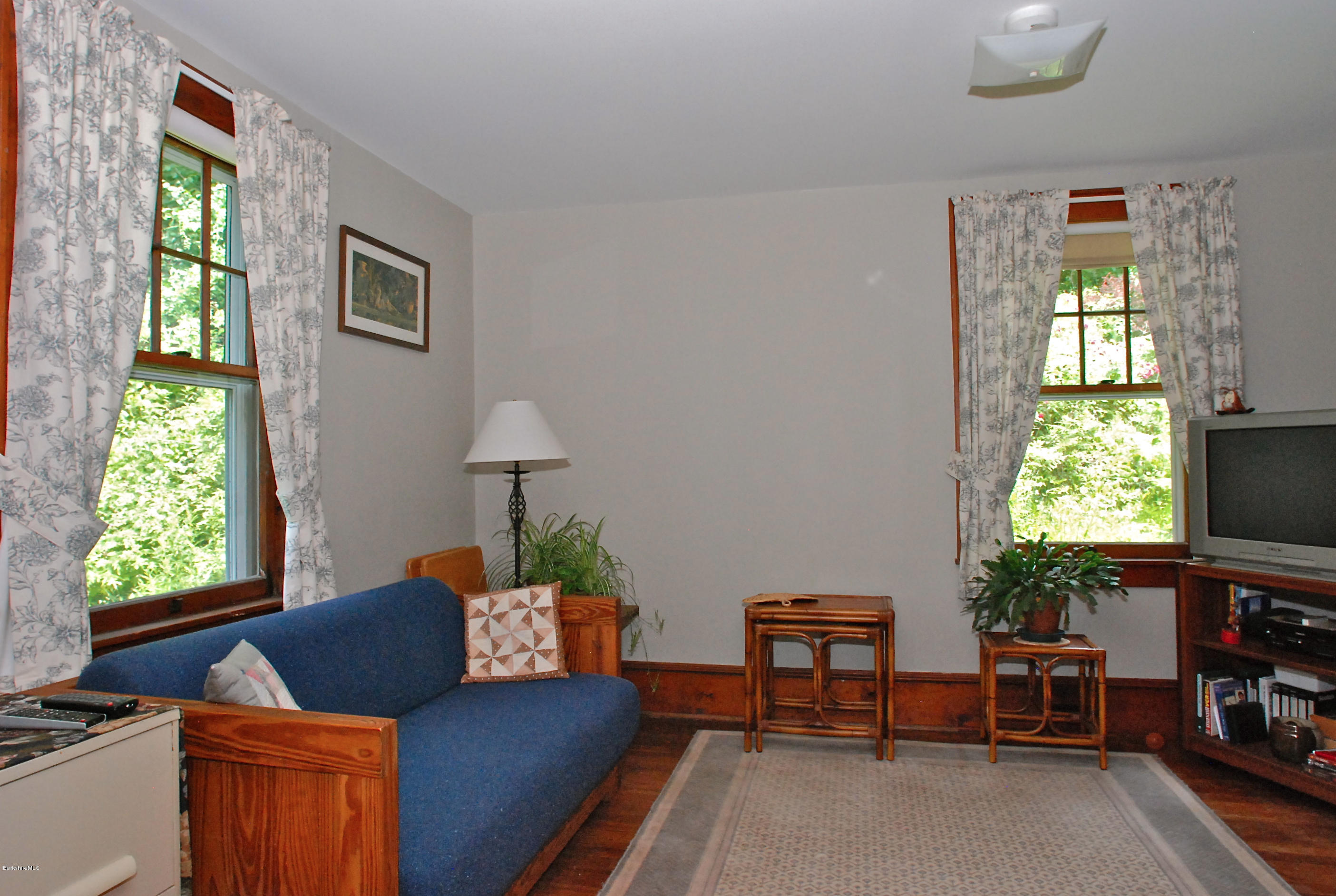 49 River Road Monterey, MA 01245 - Photo 15 of 43 a living room with furniture and a flat screen tv