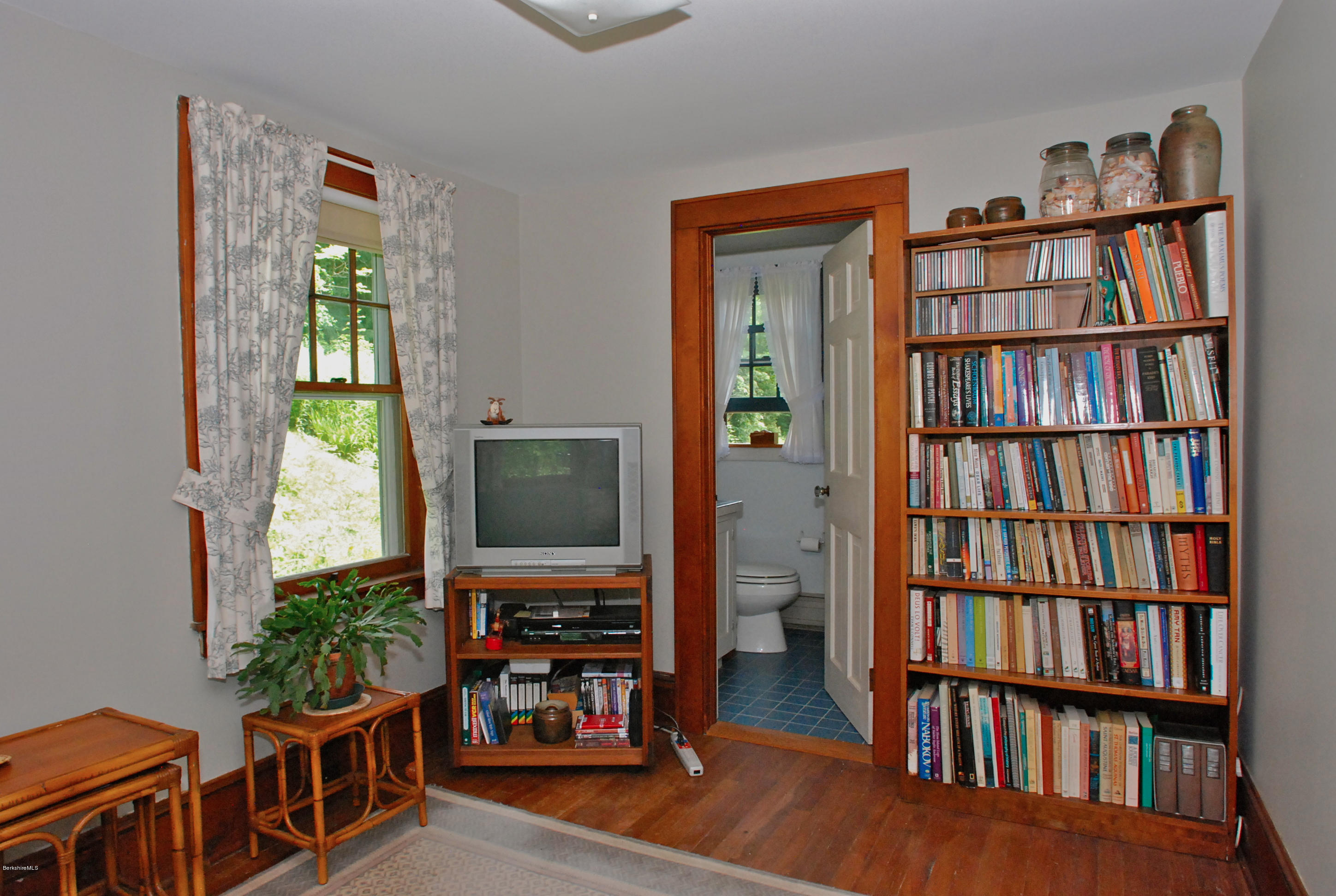 49 River Road Monterey, MA 01245 - Photo 16 of 43 a living room with furniture and a flat screen tv
