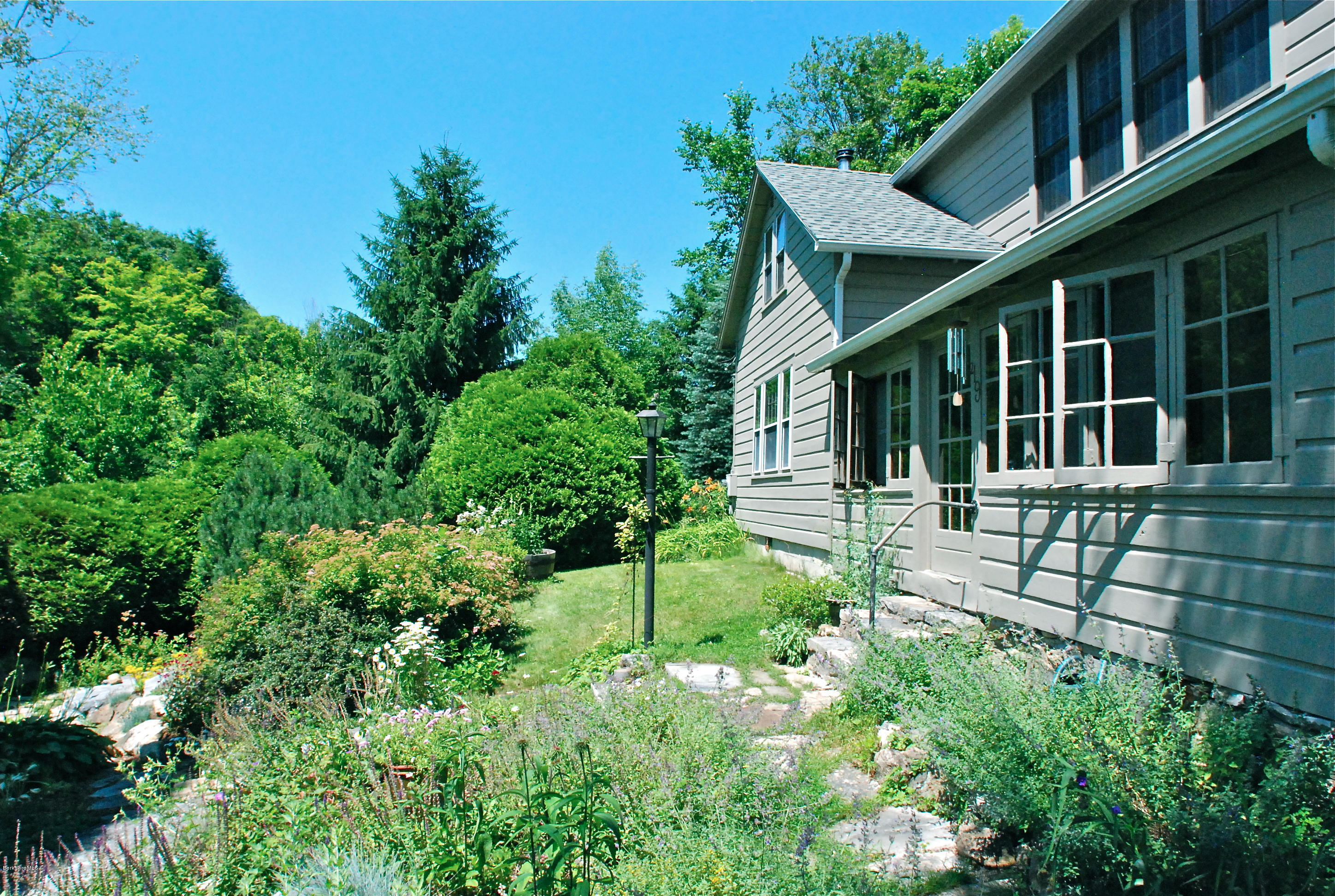 49 River Road Monterey, MA 01245 - Photo 3 of 43 a house view with a garden space