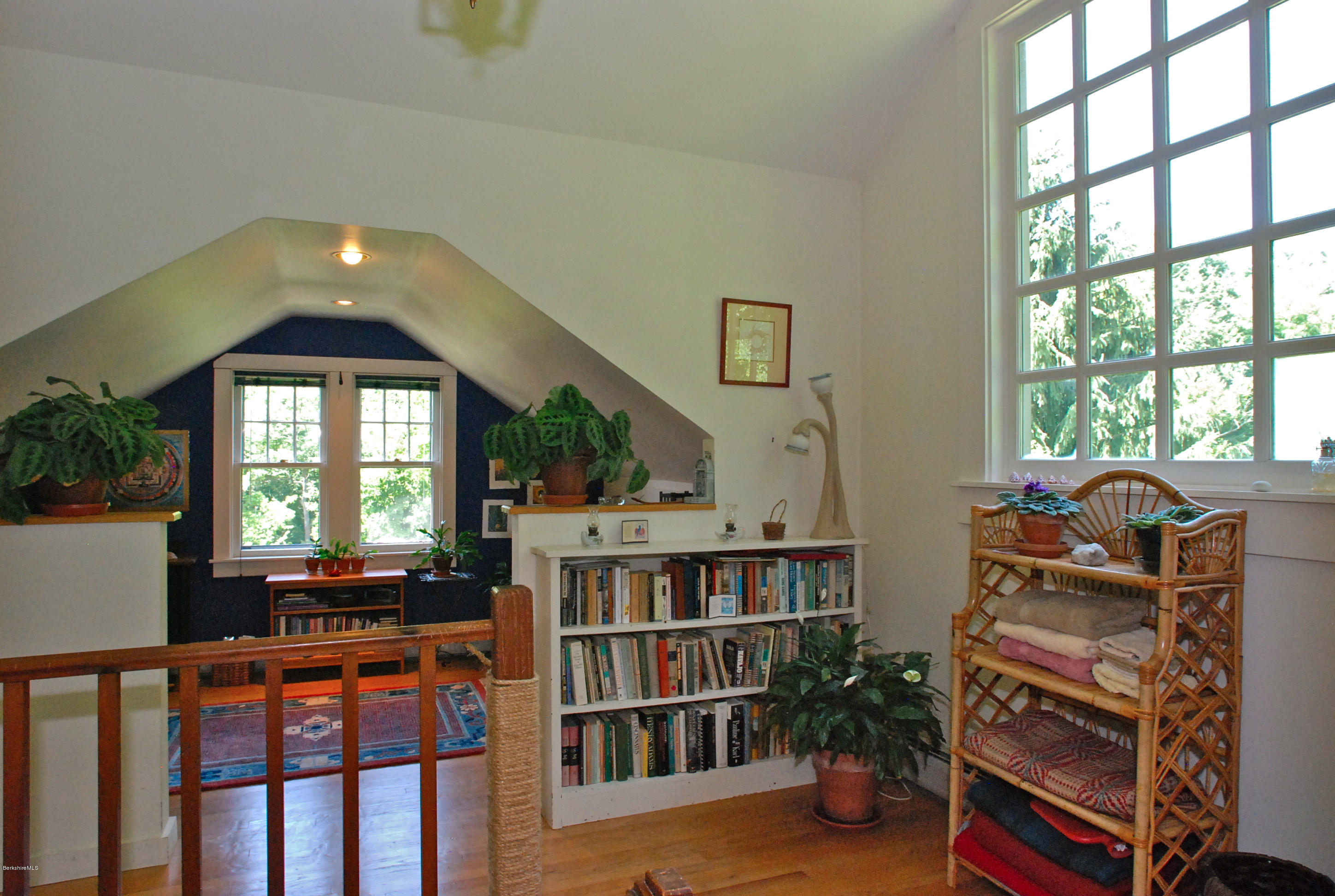 49 River Road Monterey, MA 01245 - Photo 22 of 43 a living room with furniture and a book shelf