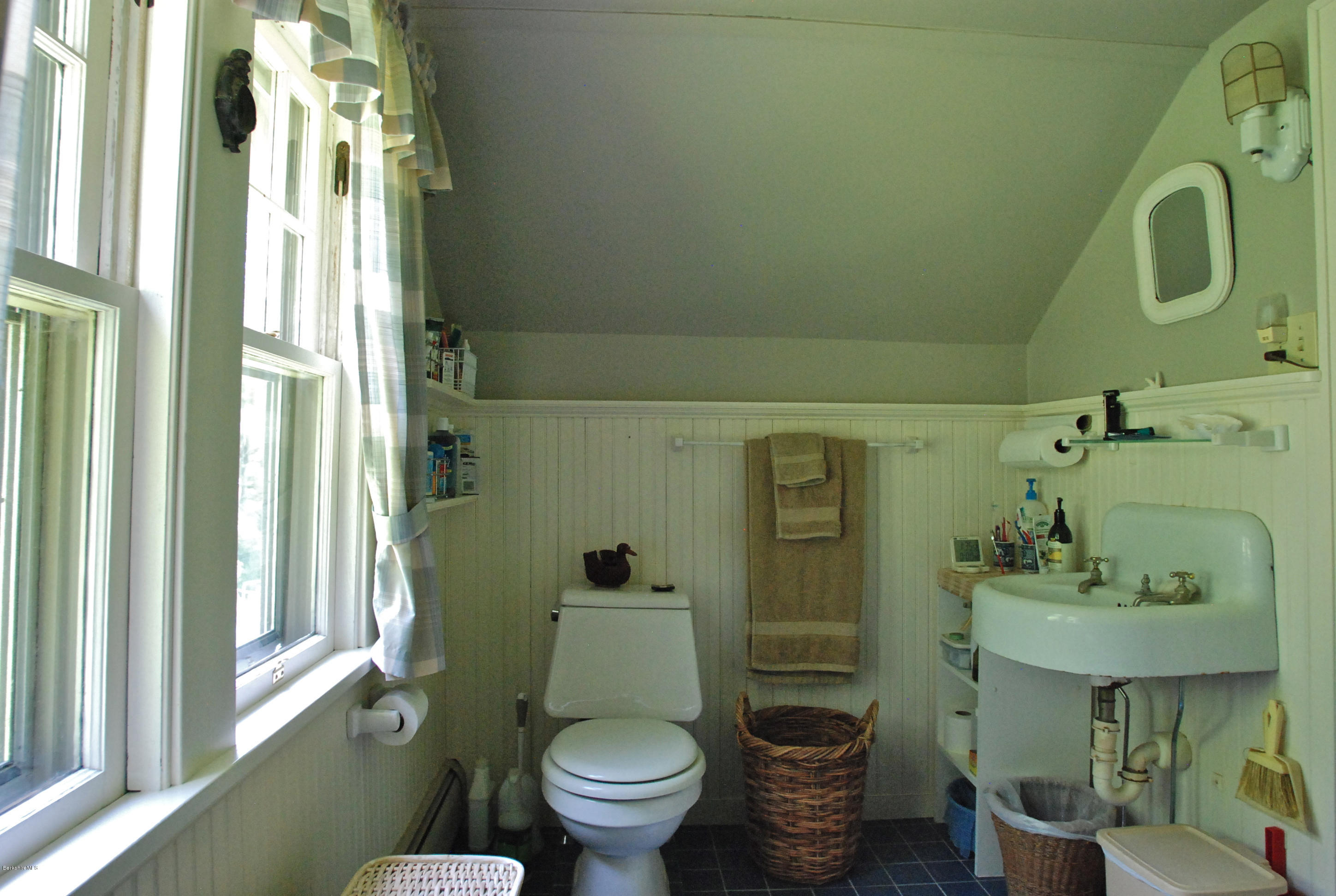49 River Road Monterey, MA 01245 - Photo 26 of 43 a bathroom with a sink toilet and shower