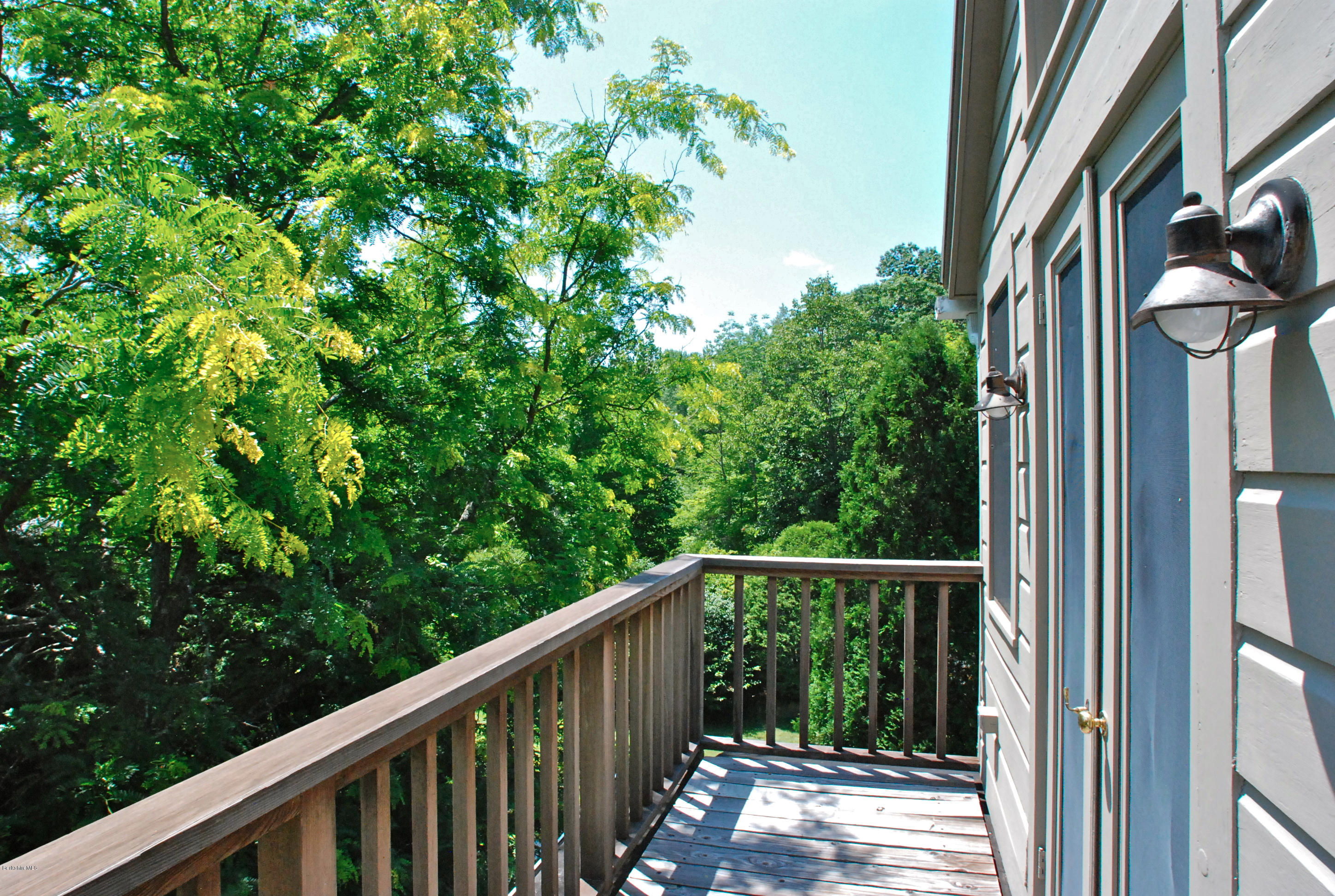 49 River Road Monterey, MA 01245 - Photo 29 of 43 a view of a balcony with wooden floor