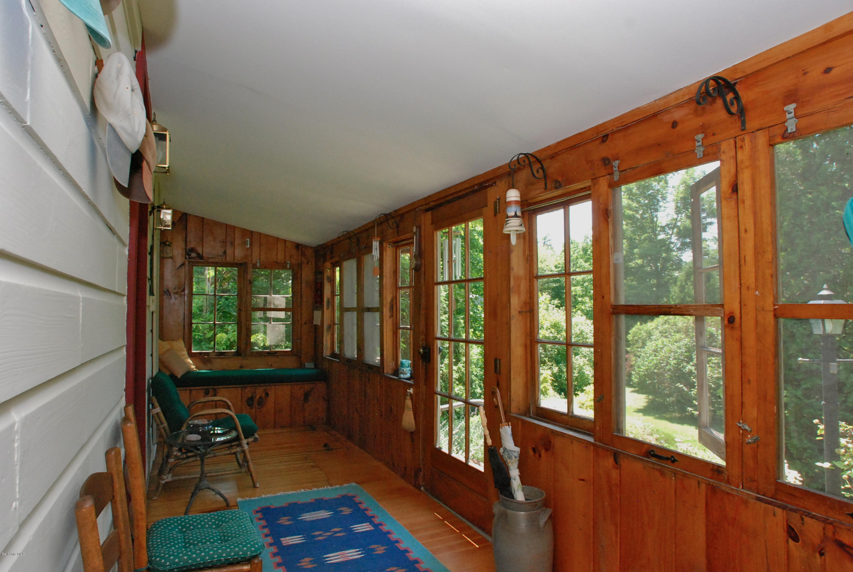 49 River Road Monterey, MA 01245 - Photo 4 of 43 a view of an entryway with wooden floor and door