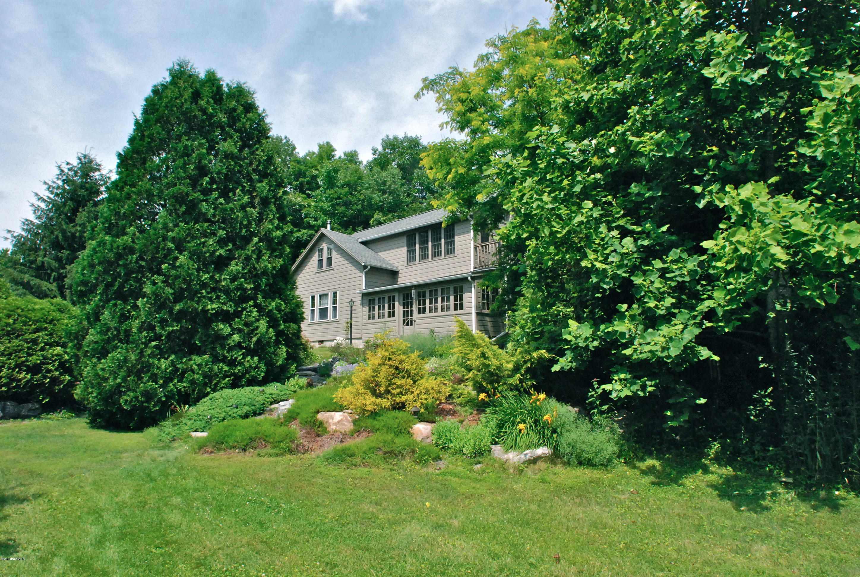 49 River Road Monterey, MA 01245 - Photo 32 of 43 a view of a house with a big yard and large trees