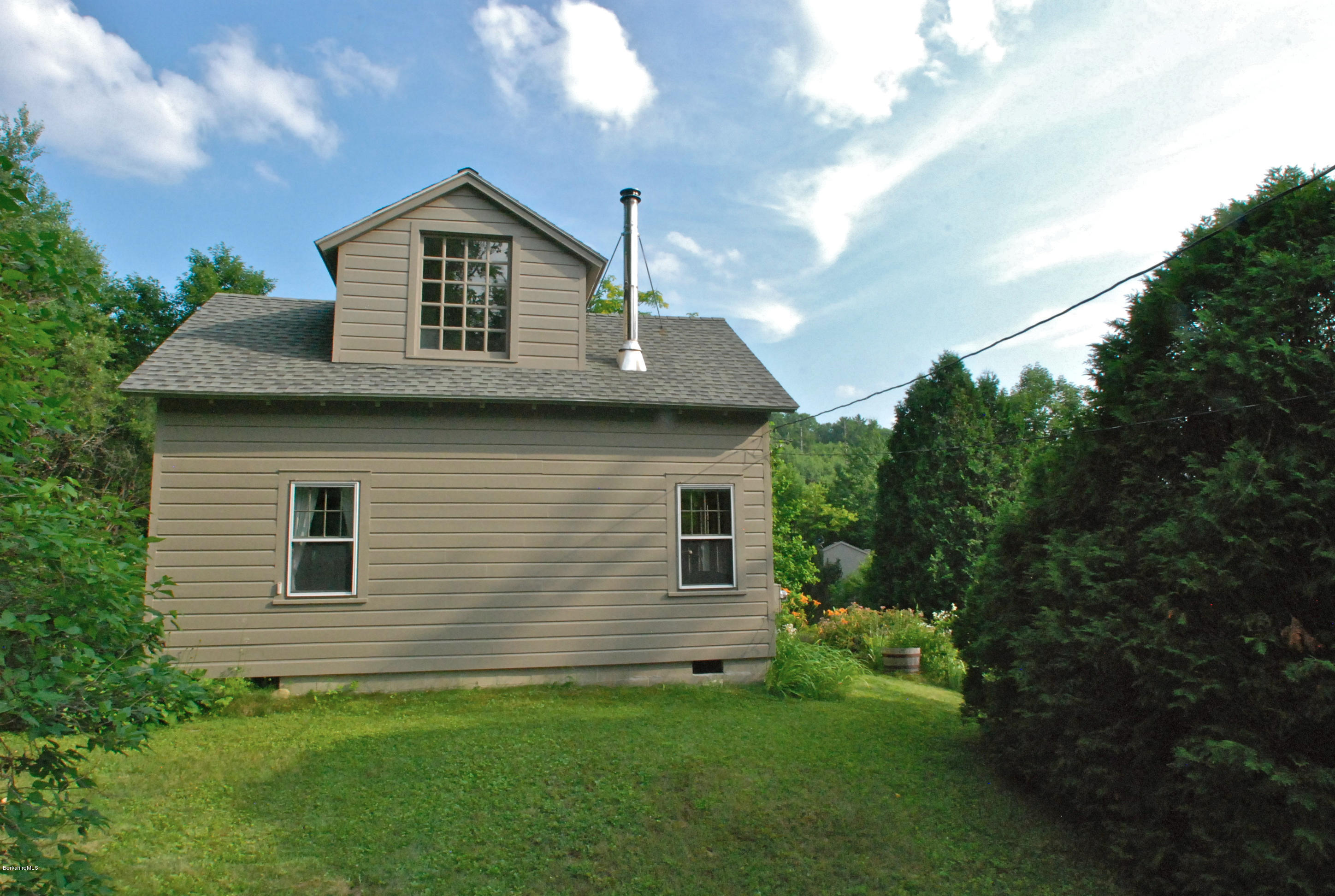 49 River Road Monterey, MA 01245 - Photo 34 of 43 a view of a house with a yard