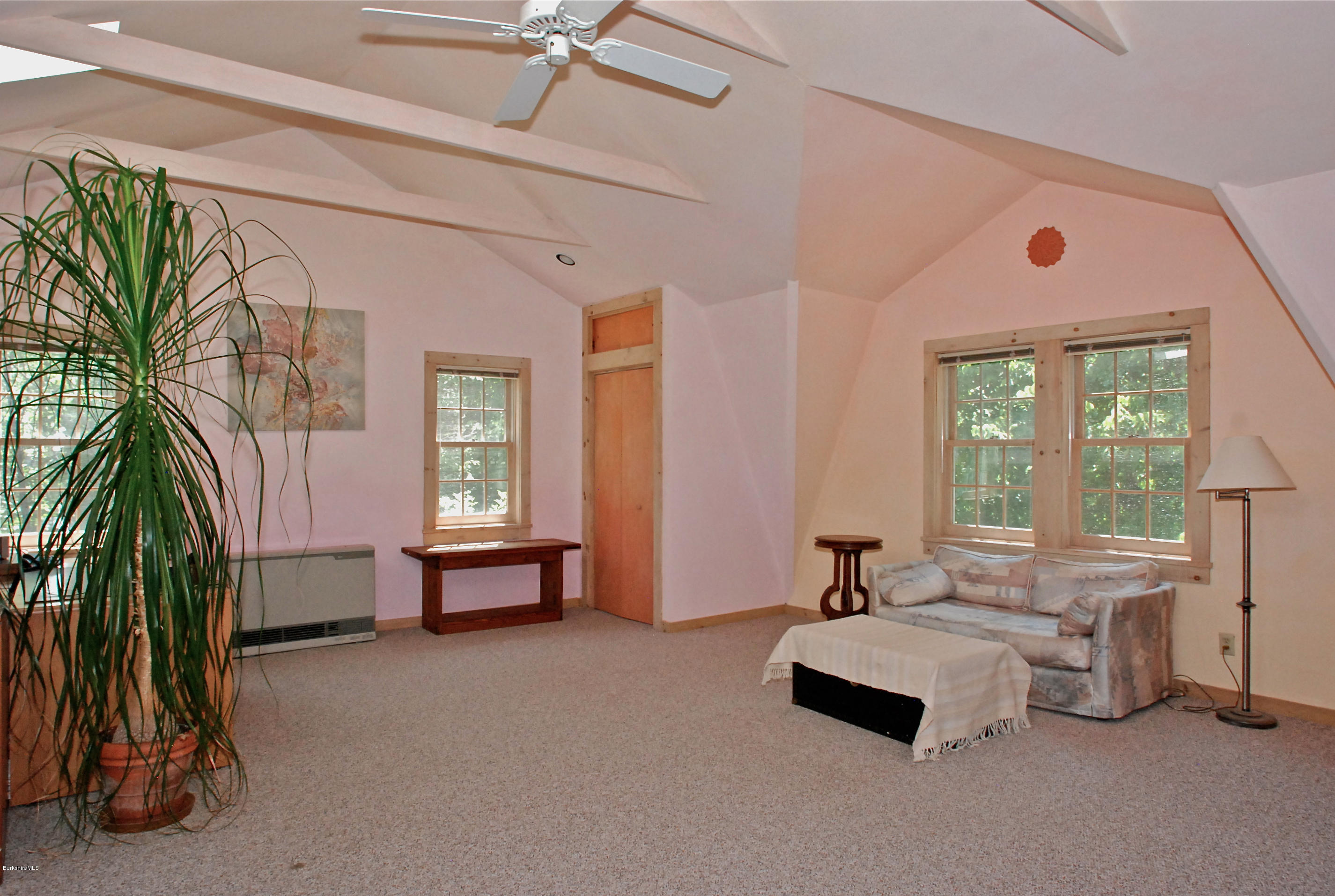 49 River Road Monterey, MA 01245 - Photo 42 of 43 a living room with furniture and a potted plant