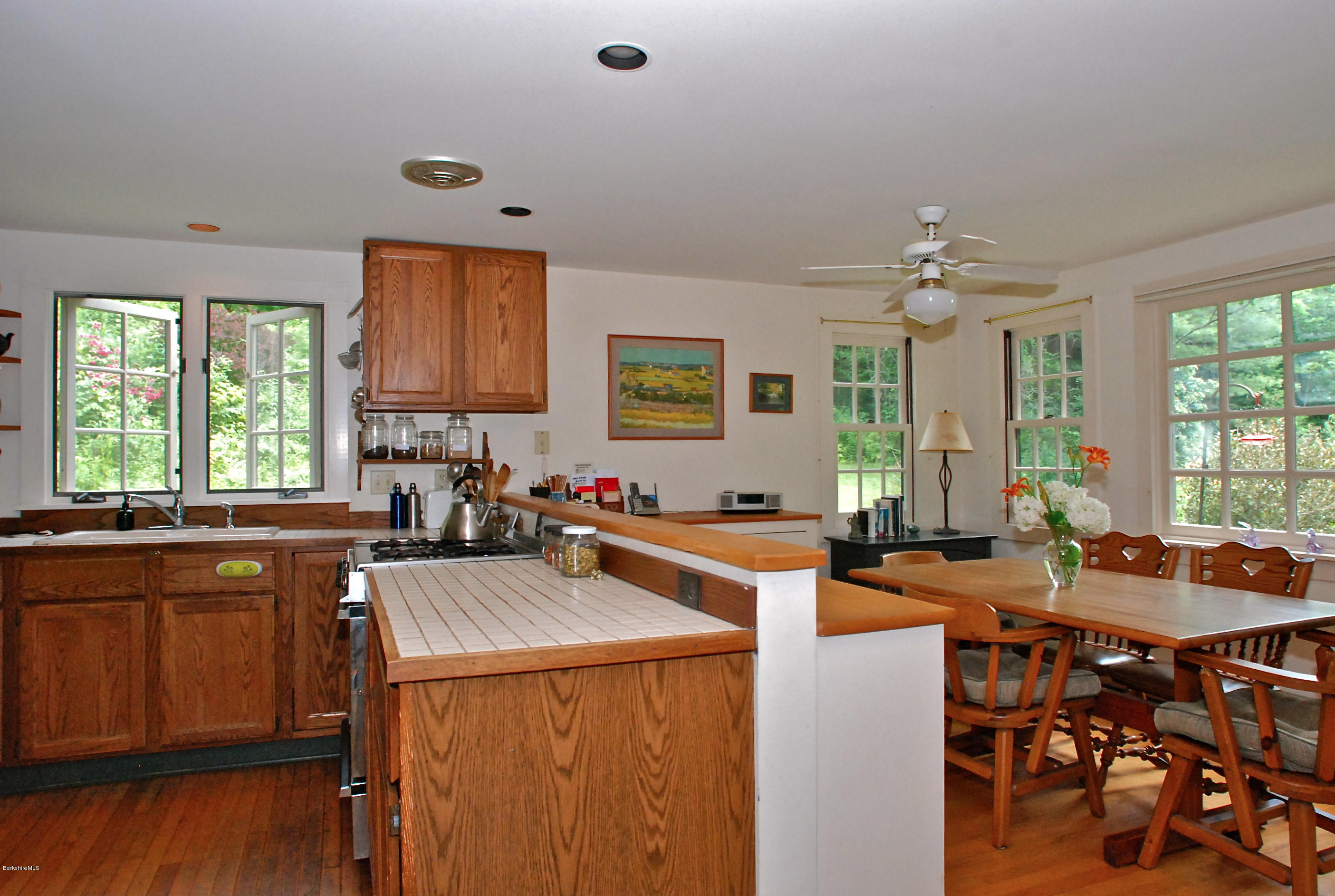 49 River Road Monterey, MA 01245 - Photo 6 of 43 a view of a kitchen and dining room