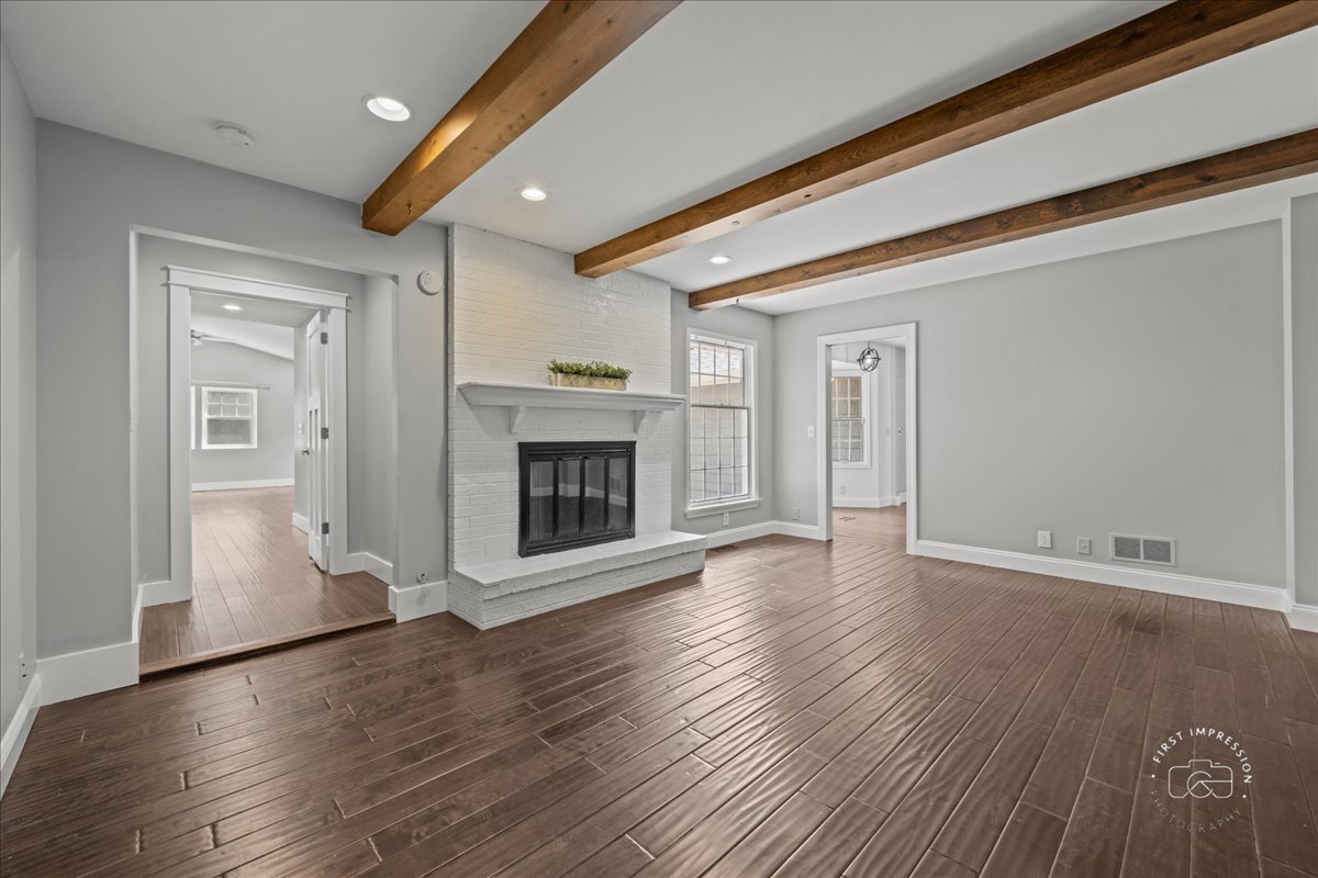 51 Burgess Road Geneva, IL 60134 - Photo 13 of 32 a view of a livingroom with wooden floor and a fireplace