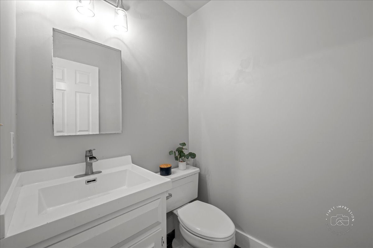 51 Burgess Road Geneva, IL 60134 - Photo 25 of 32 a white toilet sitting next to a bathroom sink