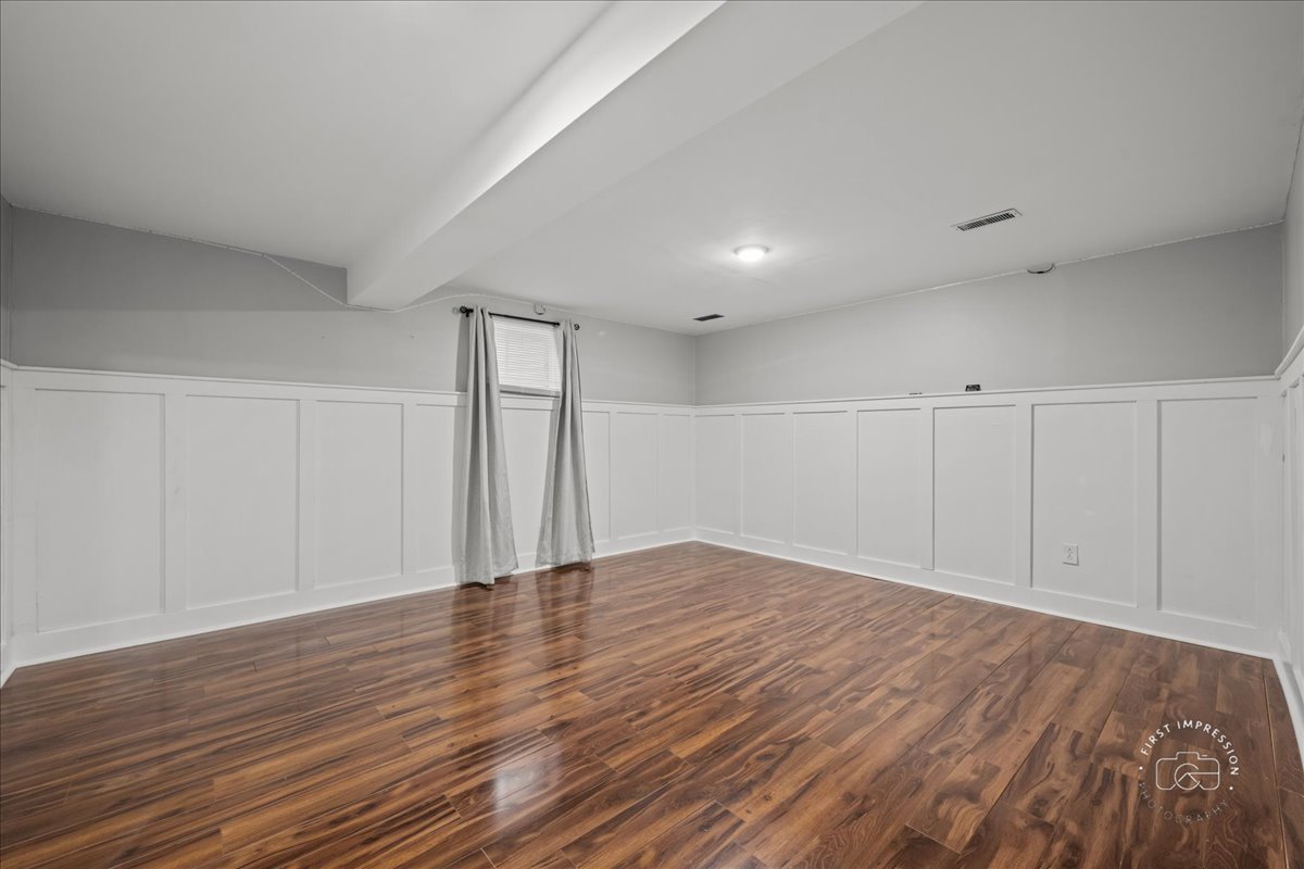 51 Burgess Road Geneva, IL 60134 - Photo 29 of 32 a view of an empty room with wooden floor