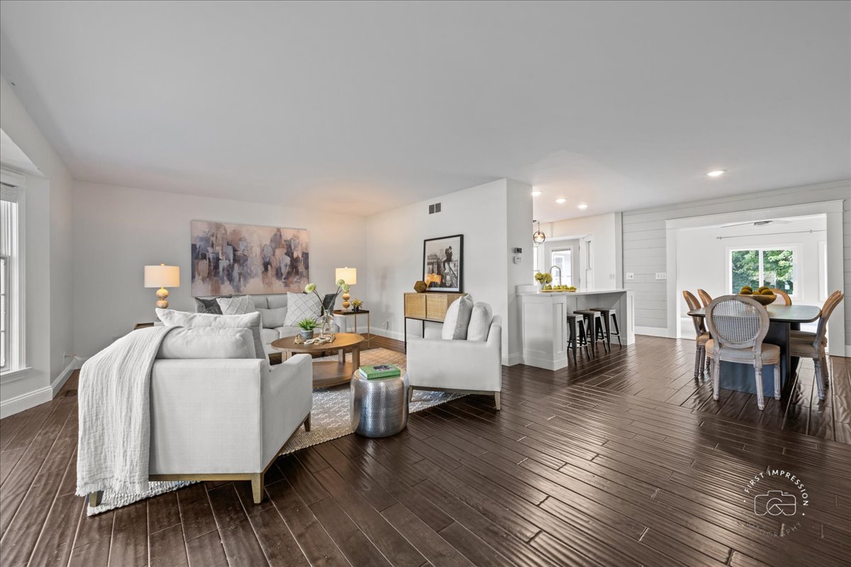51 Burgess Road Geneva, IL 60134 - Photo 4 of 32 a living room with furniture and a wooden floor