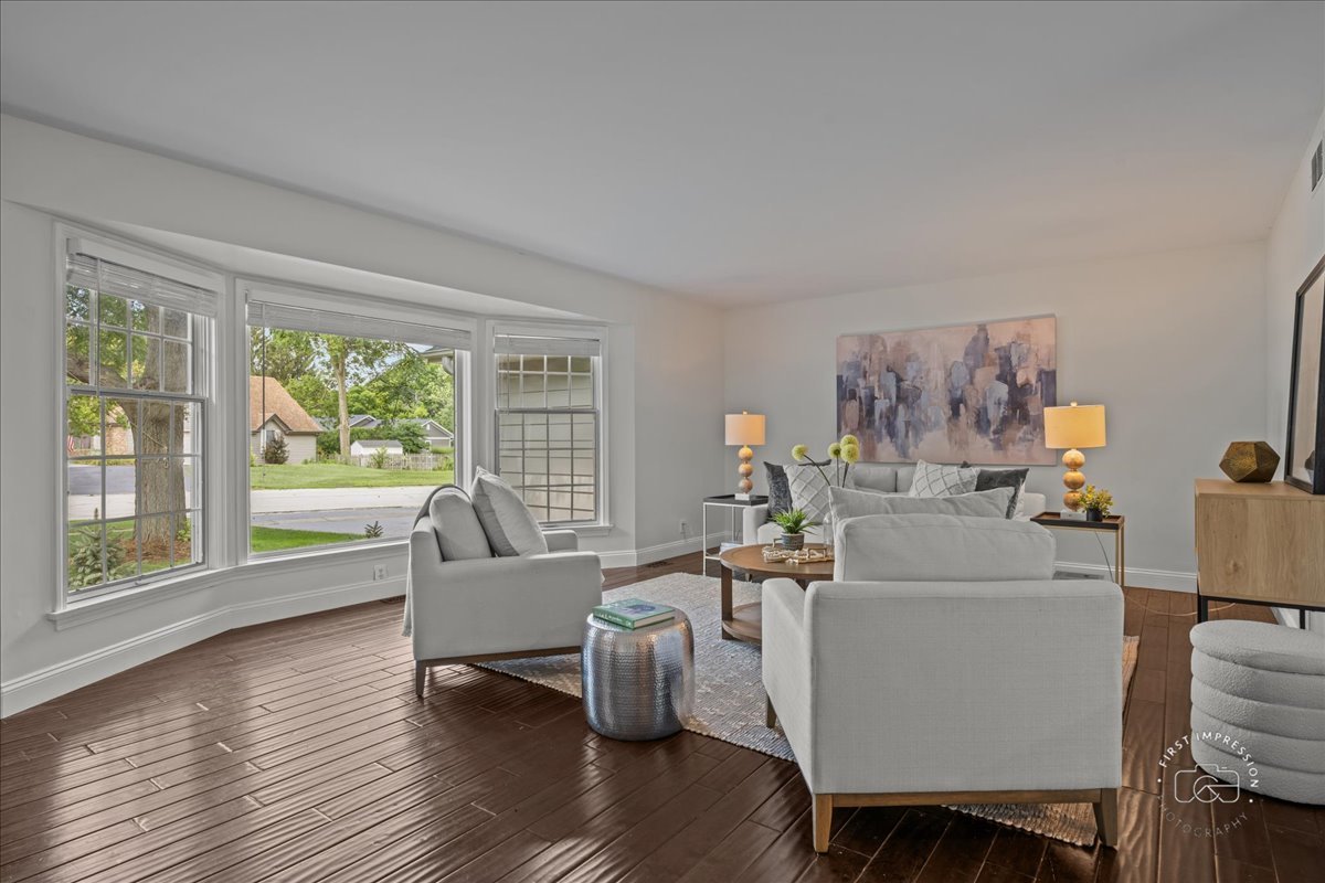 51 Burgess Road Geneva, IL 60134 - Photo 6 of 32 a living room with furniture and a large window