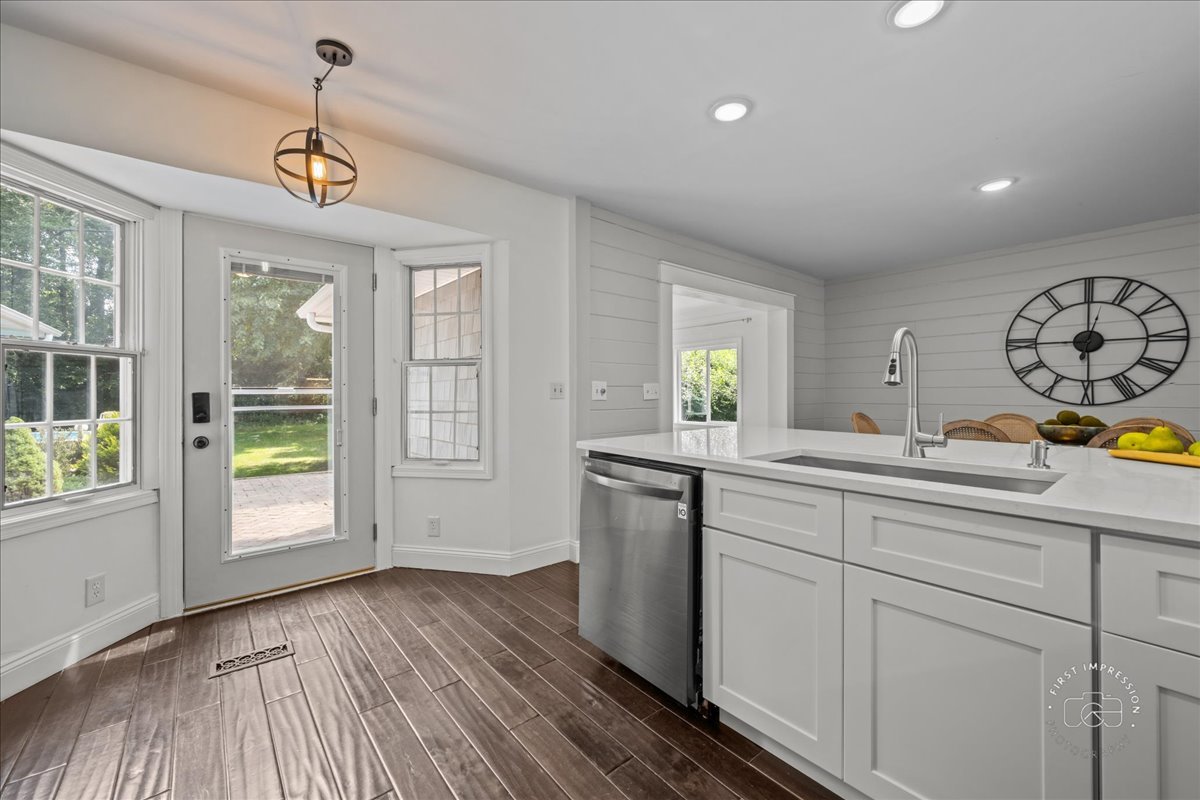 51 Burgess Road Geneva, IL 60134 - Photo 10 of 32 a bathroom with a sink a mirror and a window