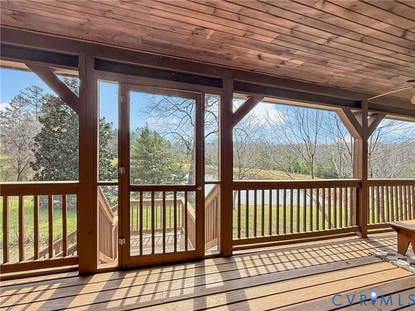 a view of porch with wooden floor