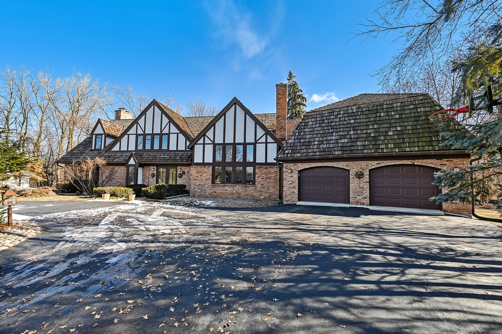 803 Merry Lane Oak Brook, IL 60523 - Photo 1 of 39 a front view of a house with a yard