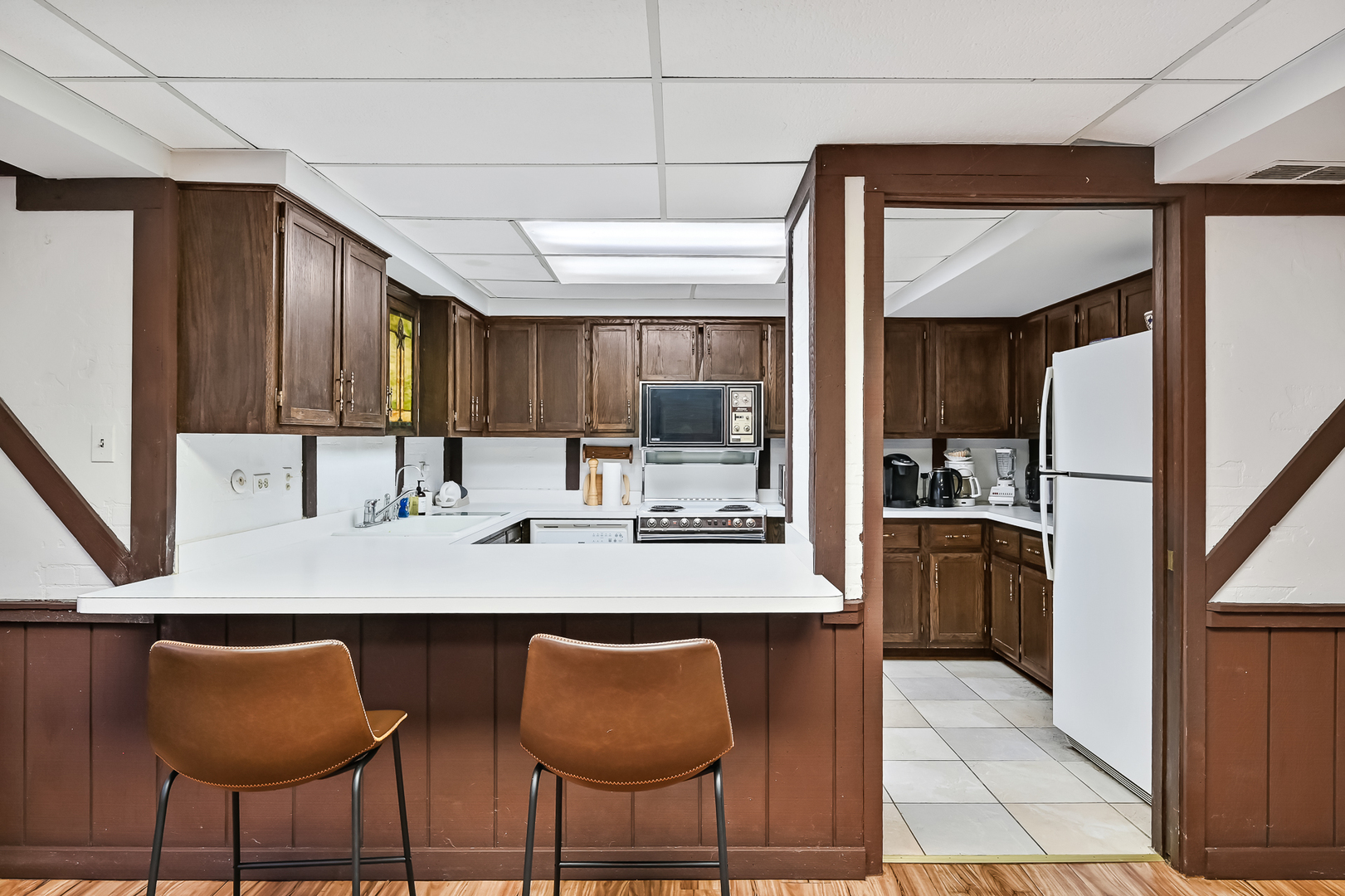 803 Merry Lane Oak Brook, IL 60523 - Photo 30 of 39 a kitchen with stainless steel appliances granite countertop a sink and a refrigerator