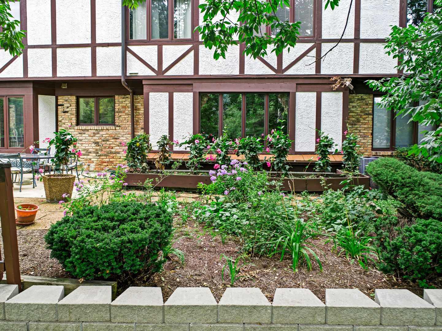 803 Merry Lane Oak Brook, IL 60523 - Photo 36 of 39 a view of a house with backyard sitting area and garden