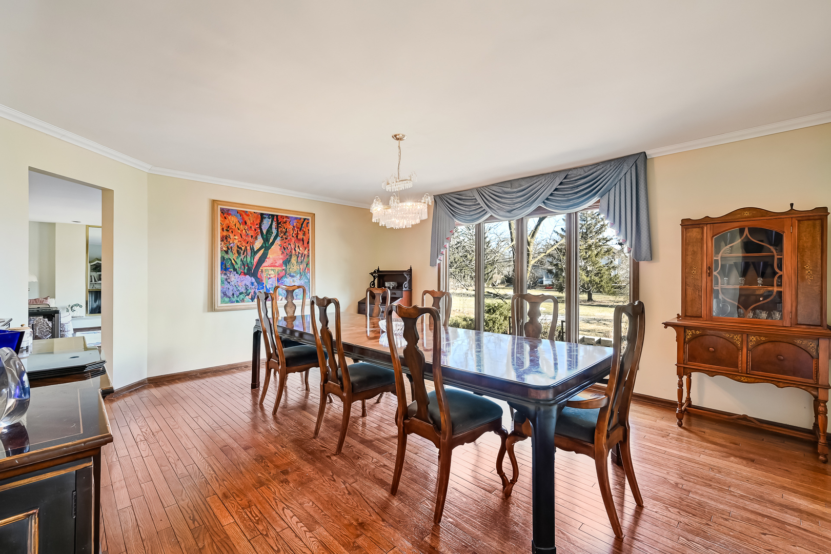 803 Merry Lane Oak Brook, IL 60523 - Photo 7 of 39 a dining room with furniture window and wooden floor