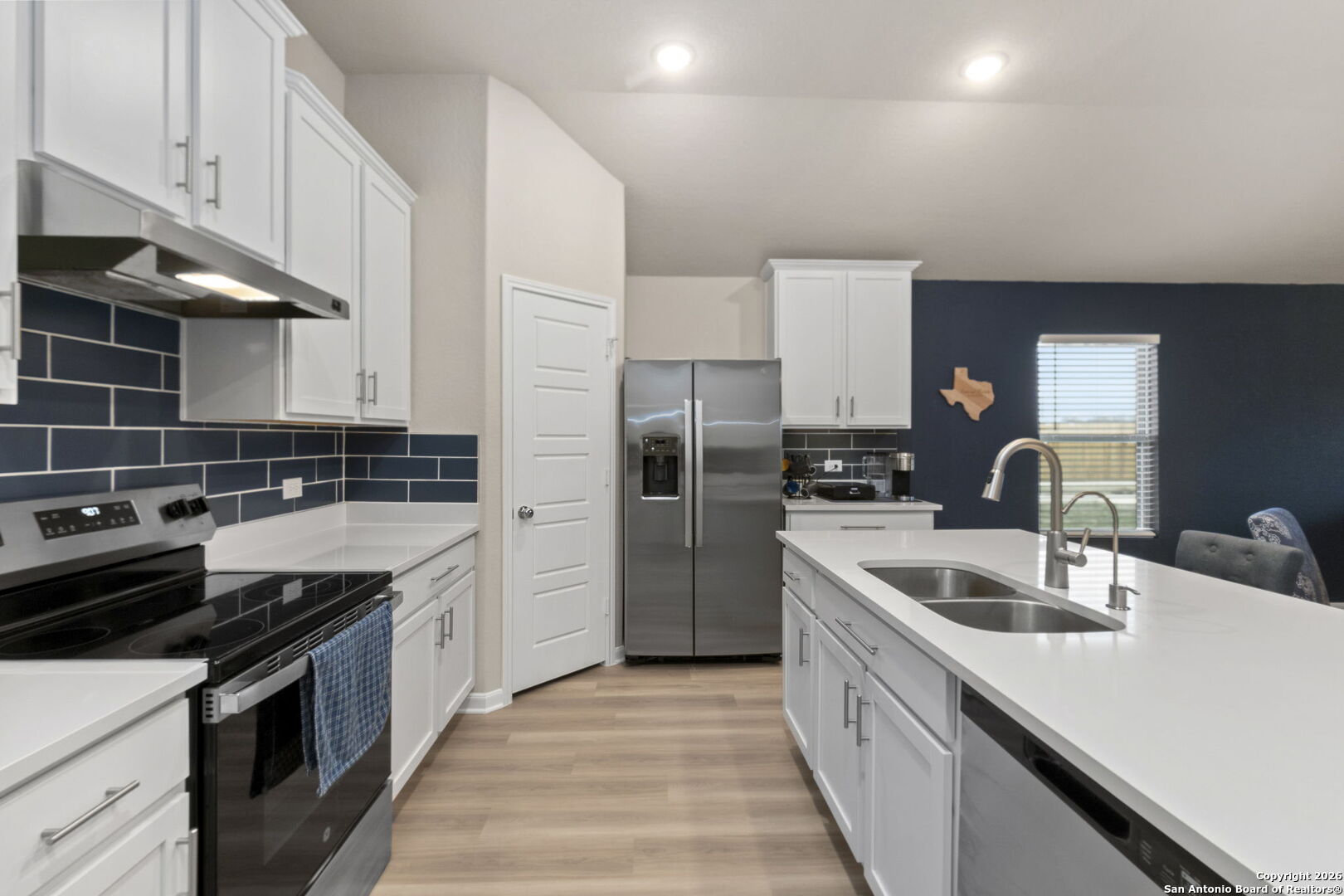 20825 Pleasanton Road San Antonio, TX 78264 - Photo 12 of 33 a kitchen with a sink cabinets and stainless steel appliances