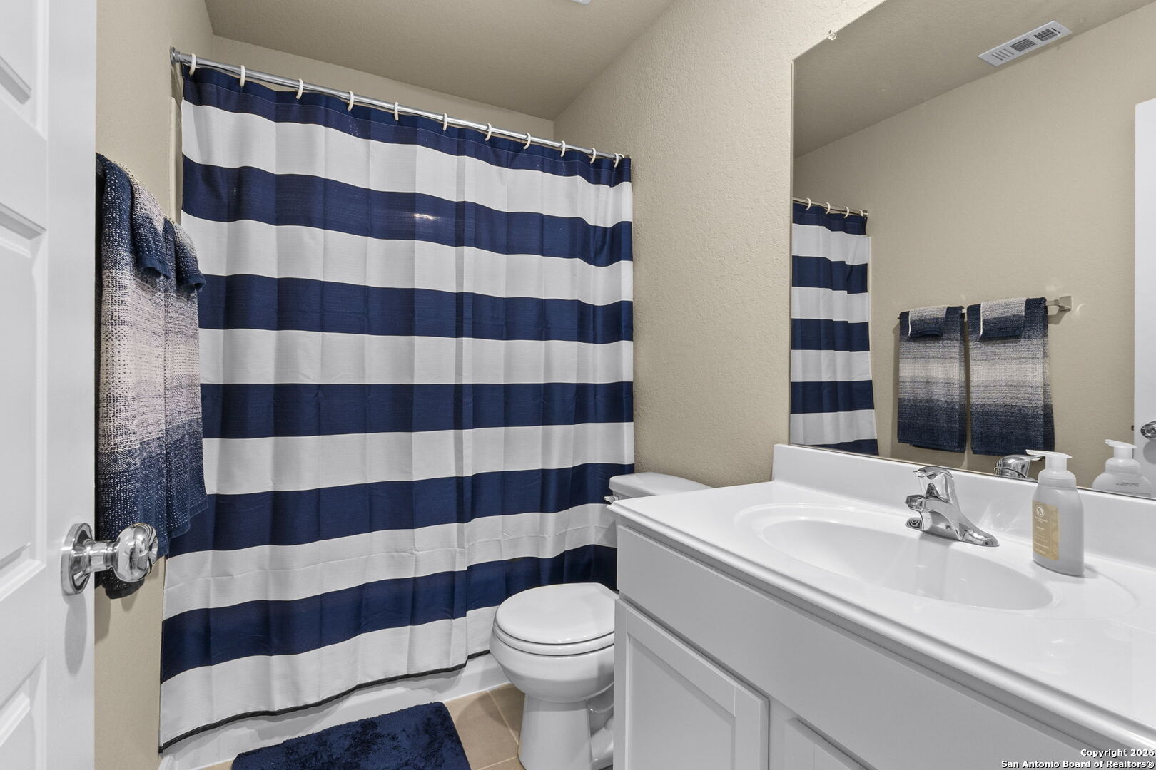 20825 Pleasanton Road San Antonio, TX 78264 - Photo 15 of 33 a bathroom with a sink a toilet a shower and sink