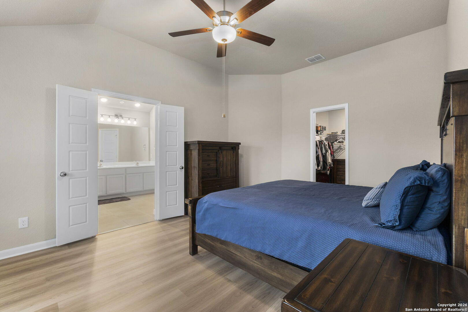 20825 Pleasanton Road San Antonio, TX 78264 - Photo 17 of 33 a bedroom with a bed and a walk in closet