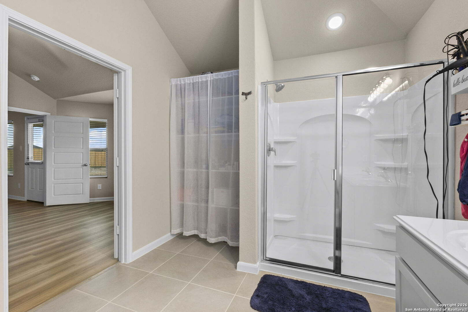 20825 Pleasanton Road San Antonio, TX 78264 - Photo 19 of 33 a bathroom with a glass shower door