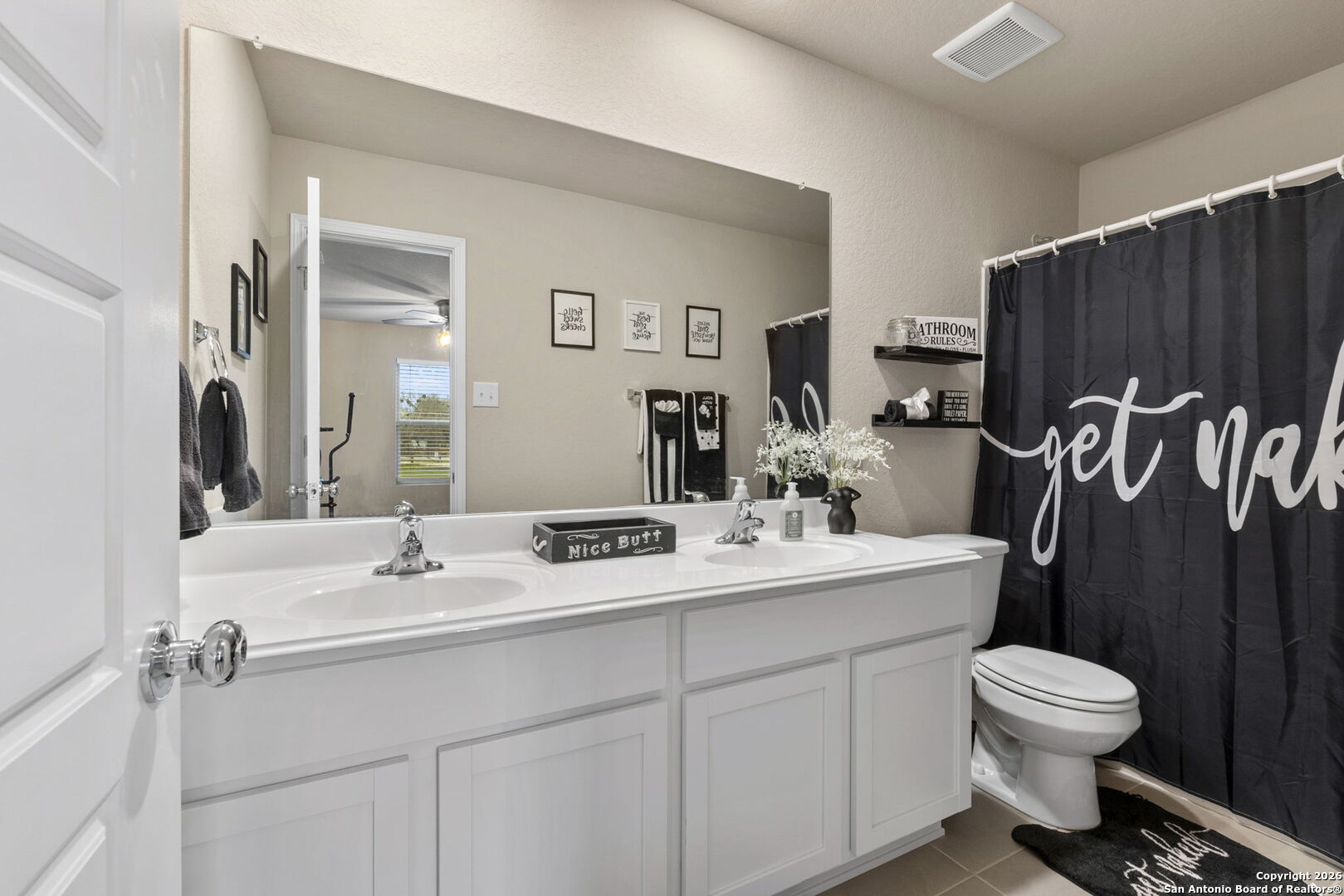 20825 Pleasanton Road San Antonio, TX 78264 - Photo 24 of 33 a bathroom with a toilet sink and mirror