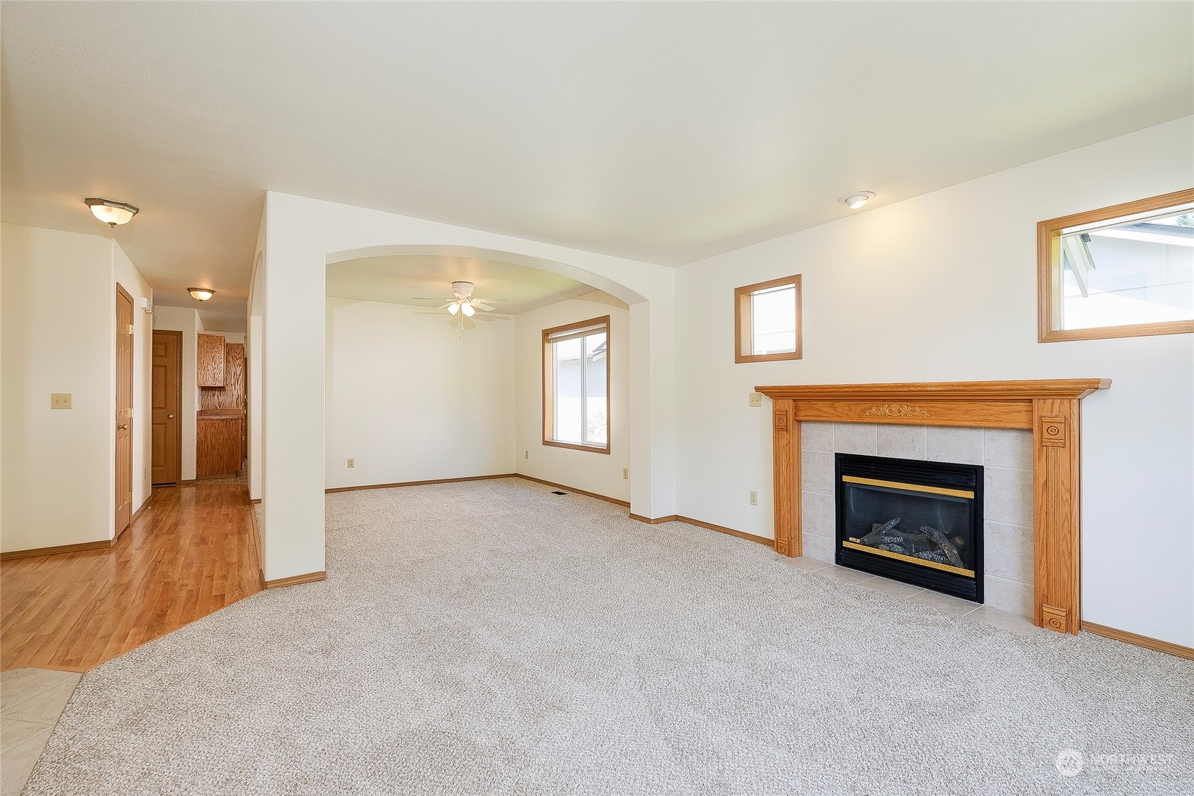 4700 Parker Road East Sumner, WA 98390 - Photo 6 of 40 an empty room with windows and a fireplace