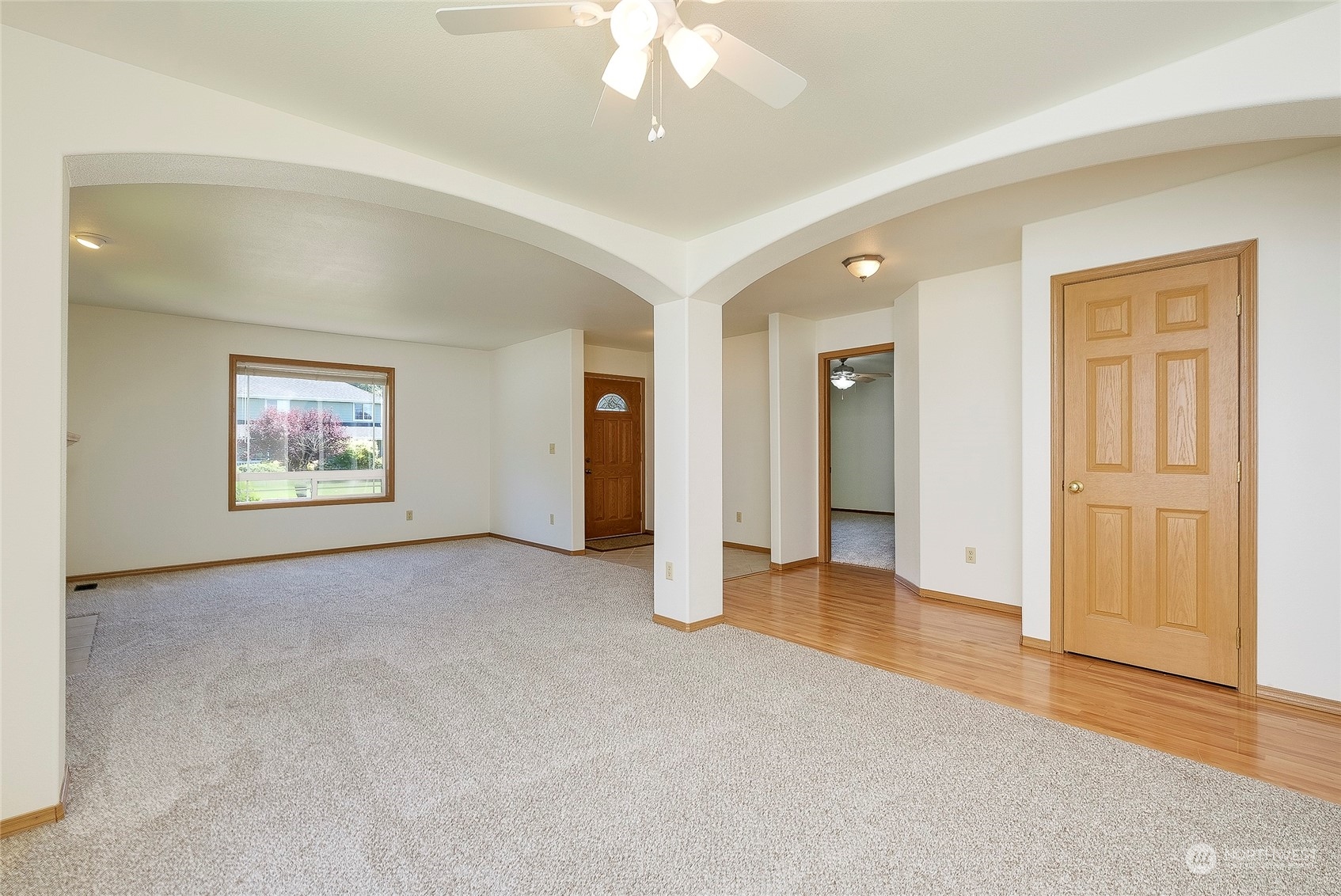 4700 Parker Road East Sumner, WA 98390 - Photo 9 of 40 an empty room with windows and ceiling fan
