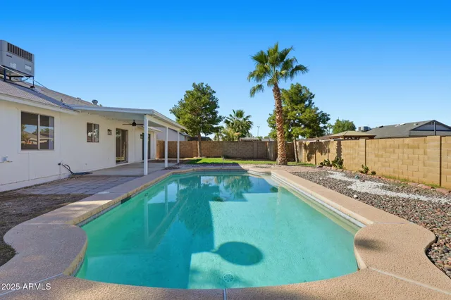a view of a house with swimming pool