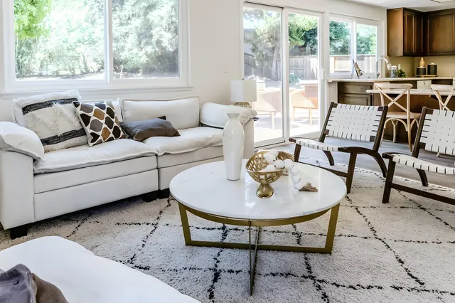 a living room with furniture and a table